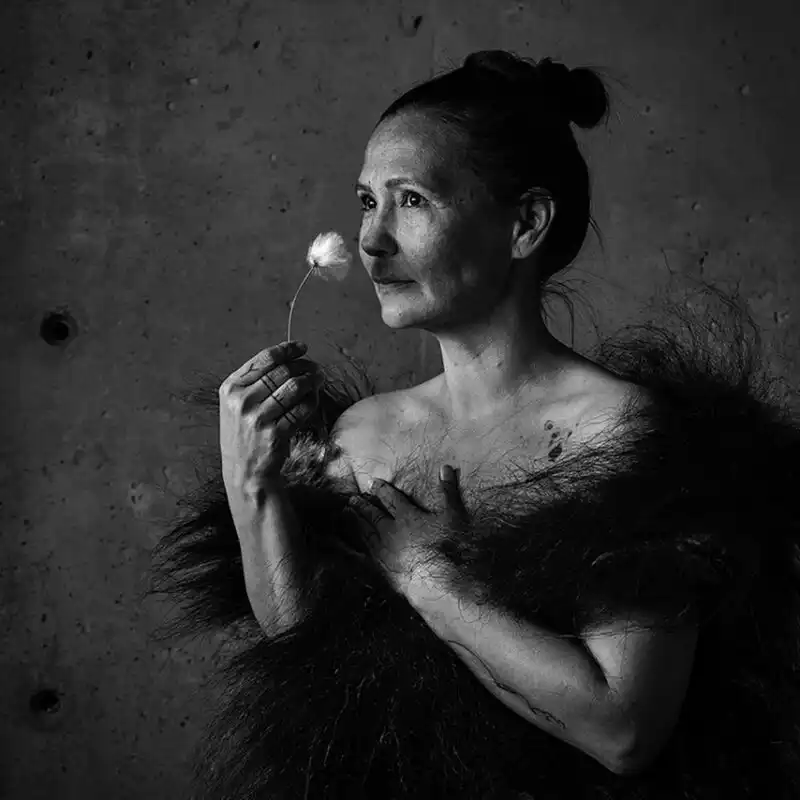 Greenlandic woman holding a flower