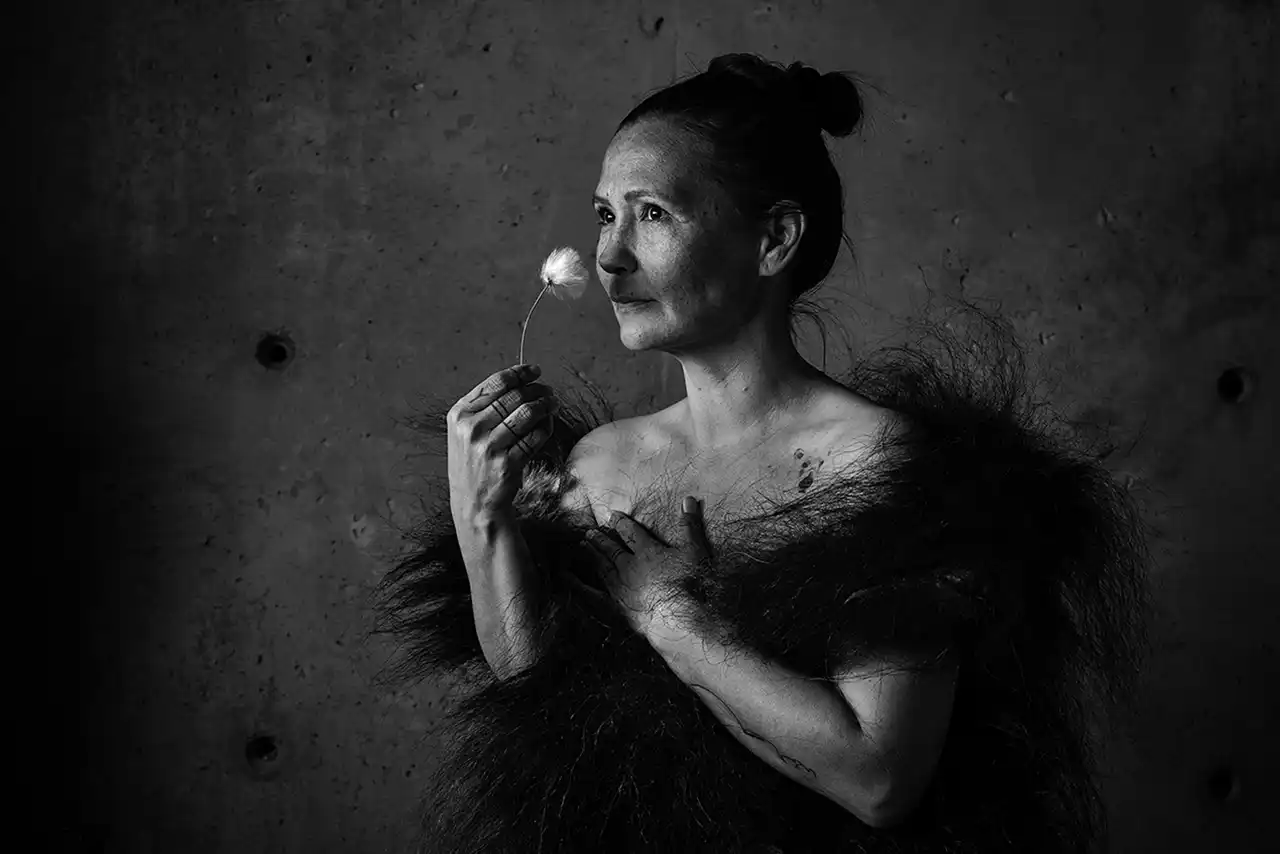 Greenlandic woman holding a flower